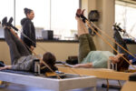 Precision Pilates Clients on a Reformer