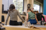 Precision Pilates Clients on a Reformer