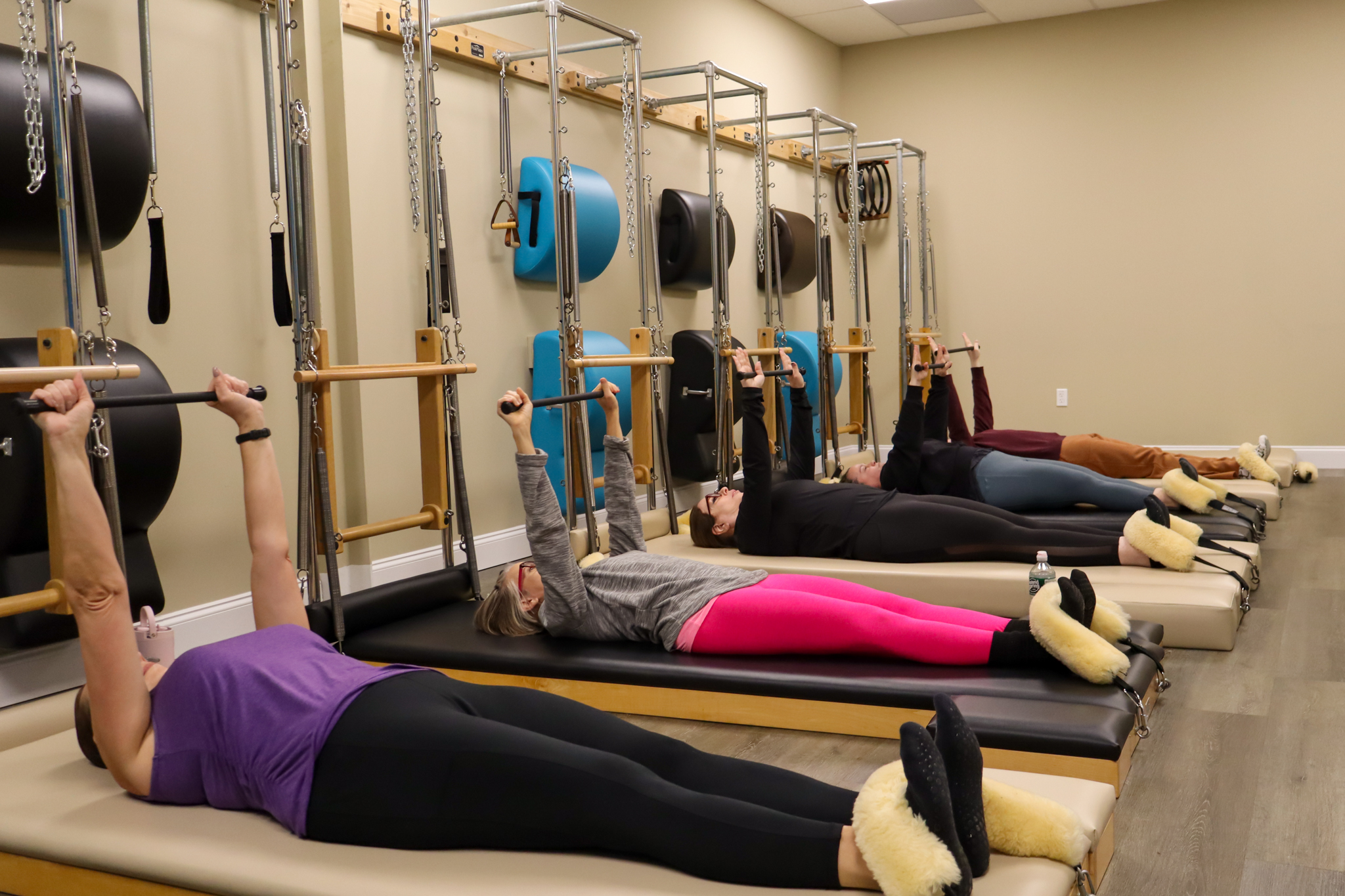 Precision Pilates Client Using The Pilates Tower Equipment
